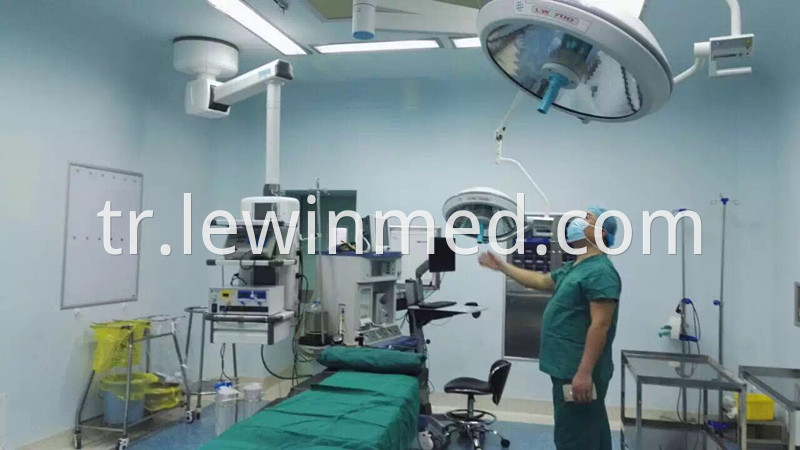 Double arm halogen surgical lamp
